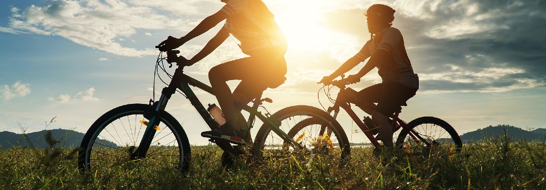 Couple biking together on a sunny day
