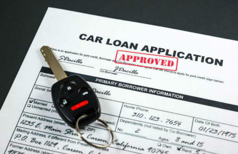 Car loan application with keys on it