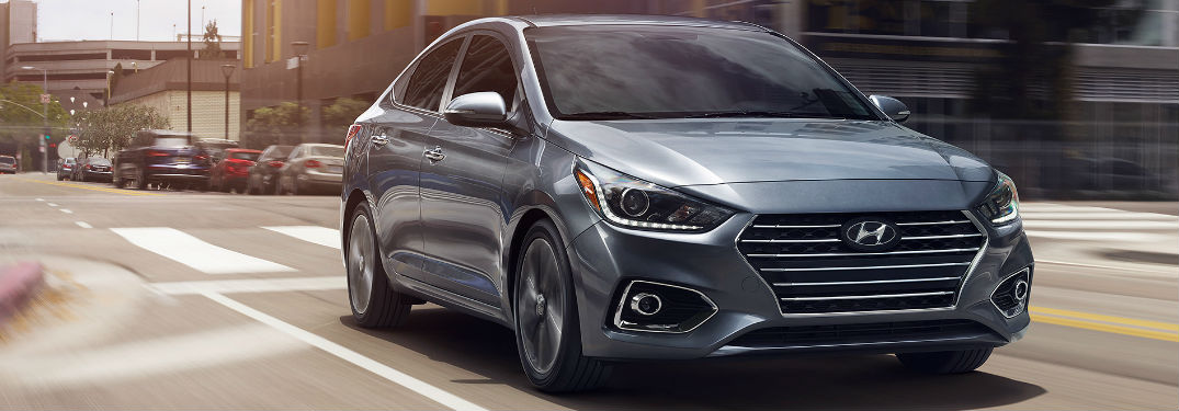 Hyundai Accent driving on a road