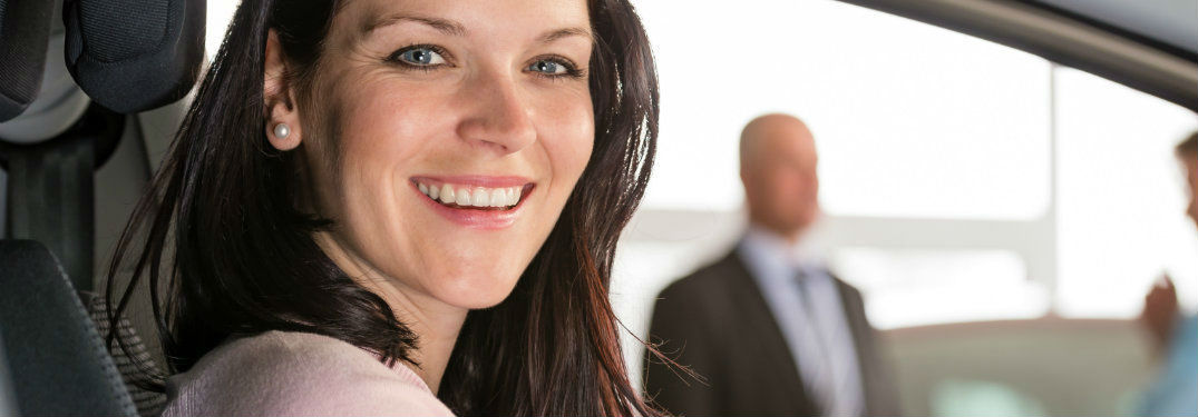 Woman at the wheel of car